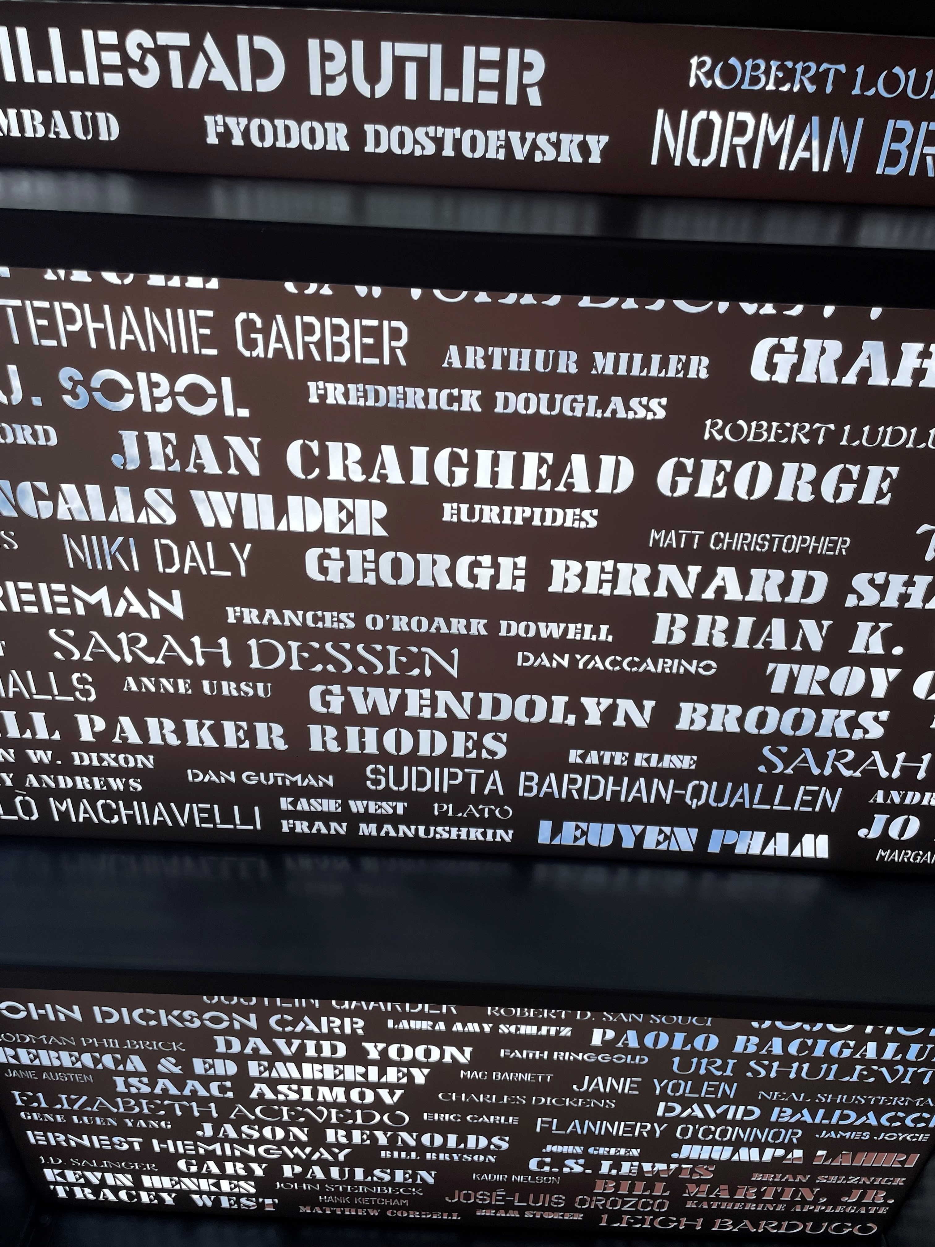 Close-up view of the Author Terraces. Two shade structures laser-etched with nearly 900 author names.