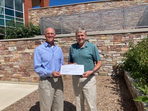 Doug Nieman, LVDL Board & Foundation President presents Dan Venturi, Lake Villa Township Supervisor, $2,400.00 check on behalf of the library’s summer reading program. 